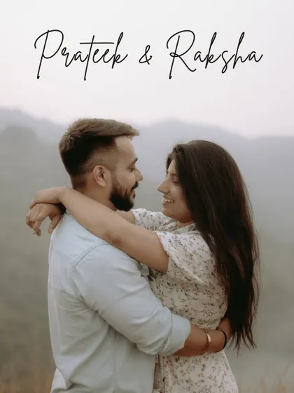 A classic, heartfelt portrait of a couple embracing, with the misty mountains creating a soft, romantic background.
