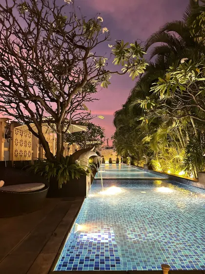 A beautiful twilight view of a poolside Sangeet venue.