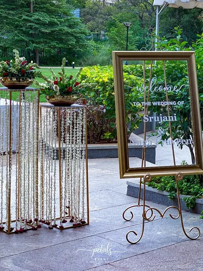 A duplicate image of the sophisticated entrance decor, with its beautiful floral arrangements and personalized welcome sign.