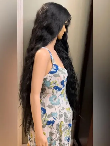 A side view of our 50-inch wavy wig. The HD lace ensures a natural hairline, even with such a long and heavy piece.