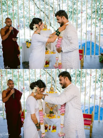 The exchange of garlands during a serene Buddhist wedding ceremony.