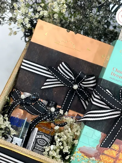 This groom-to-be hamper includes miniature bottles of Jack Daniel's and Absolut, perfect for a celebratory toast.