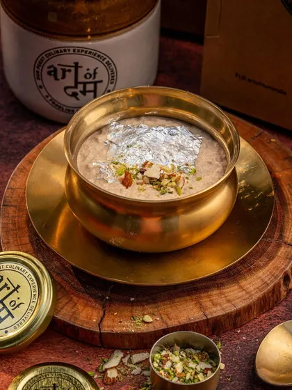 This moody, dark-toned shot of a traditional dessert in a brass bowl creates a sense of luxury and heritage. We used focused lighting to highlight the texture of the dish and the sheen of the silver leaf garnish.