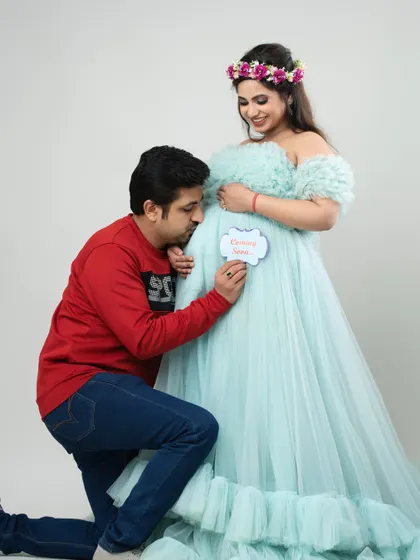 A father's love begins long before the first hello. This touching moment shows a dad-to-be whispering to the bump, a beautiful memory captured forever in my studio.