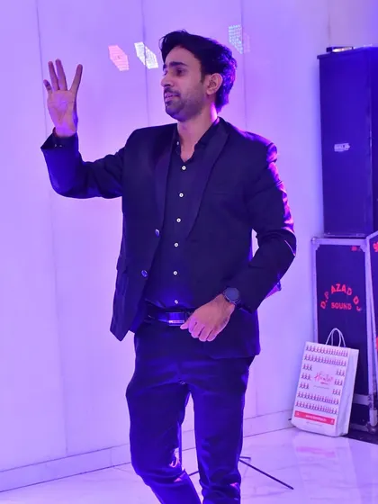 A full-body shot of me on stage, demonstrating my dynamic performance style.