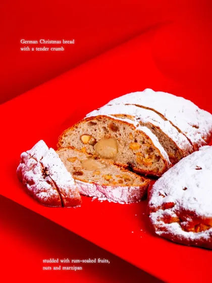 A slice of the Stollen, revealing the marzipan center and rum-soaked fruits.