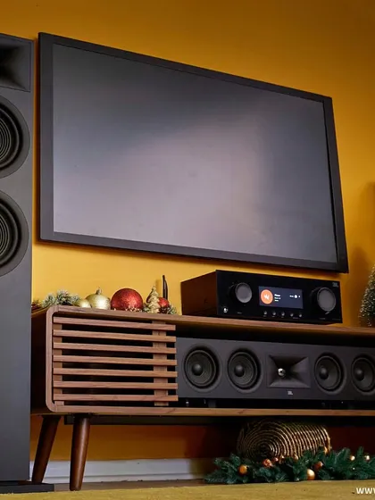 This bold, yellow-themed room is transformed for the holidays with a powerful JBL home theater system. The floor-standing speakers and matching center channel are ready to be the centerpiece of your celebrations.