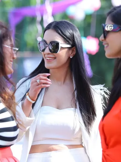 Candid shots of guests enjoying the party. Capturing the laughter and conversation among friends and family is a key part of telling the event's story.