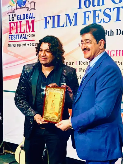 Receiving a token of appreciation from the esteemed Dr. Sandeep Marwah Ji at the Global Film Festival. It was a privilege to be honored at such a prestigious event.