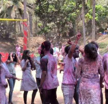 An energetic crowd dances to the music, showcasing the lively and fun atmosphere we cultivate at our festival events.