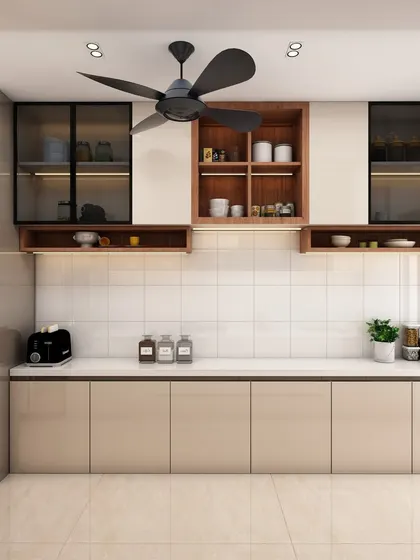 A full view of one side of the kitchen, showing the integrated oven and microwave tower and ample counter space.