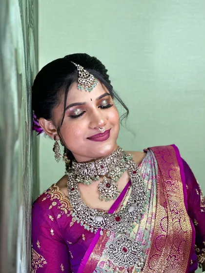 A serene and elegant portrait, highlighting the intricate details of the blouse and the beautiful makeup.