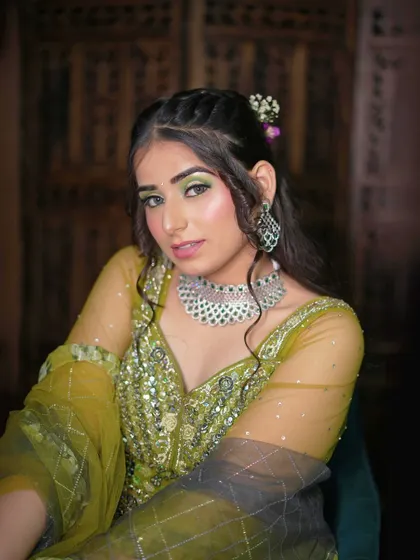 Another portrait in the green and yellow floral lehenga, exuding happiness and charm.
