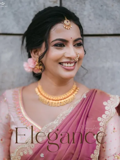 A smiling portrait of the bride, capturing her natural elegance and happiness. The soft background lighting adds a touch of magic to the shot.