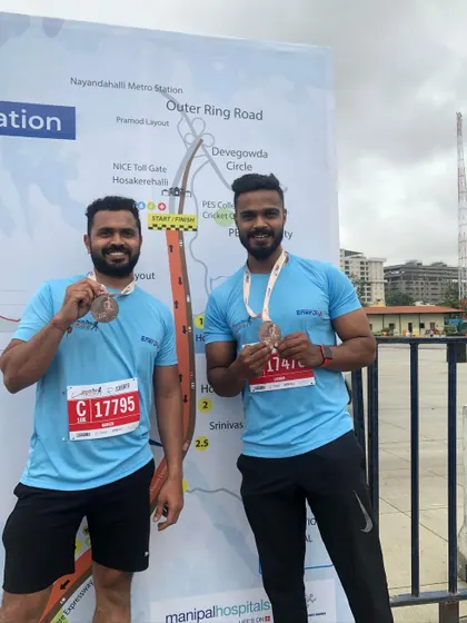 Posing with a friend by the marathon map.