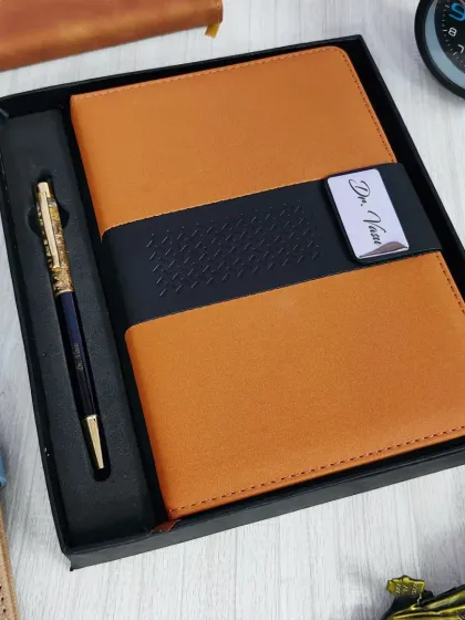 This professional diary and pen set is perfect for the office. The tan faux leather diary features a personalized nameplate, paired with a premium gold-accented pen.