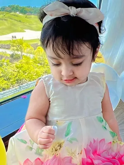 A sweet moment captured in one of our floral organza dresses. This lightweight, breezy dress is perfect for casual parties or a special day out.