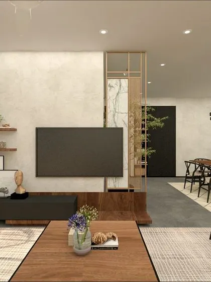 Another view of this open-plan space, highlighting the flow from the living area to the dining zone. The use of a consistent material palette, like the concrete floor and wood accents, helps unify the different functional areas into one harmonious design.
