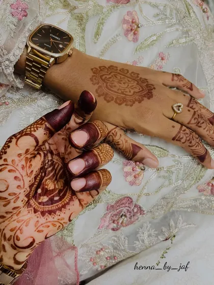 A beautiful comparison of a fresh, light-colored henna stain next to a fully matured, deep burgundy stain. This shows the magic of natural henna.