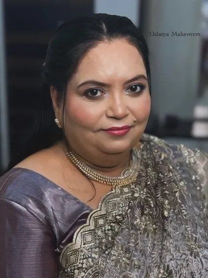 A beautiful portrait of the bride's mother. The makeup is soft and sophisticated, perfect for a reception party.