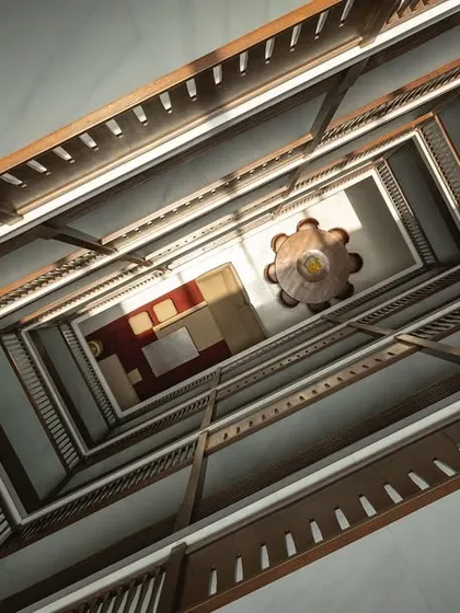 Looking directly up through the multi-story atrium, this perspective reveals the scale and complexity of the structure, drawing inspiration from the verticality of traditional Indian courtyard homes.