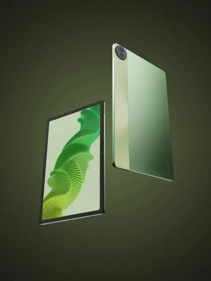 A commercial shot of the realme Pad 2, appearing to float against a green background, giving it a sleek and modern look.