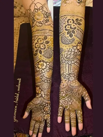 A floral bridal design that extends up the entire arm, with beautiful shading and detail.