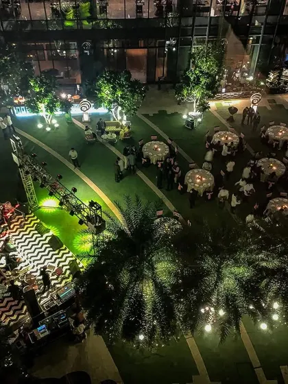 An aerial view of a festive outdoor evening event at Pullman New Delhi. This perspective shows the layout of the stage, dining area, and lighting design, demonstrating our ability to manage complex outdoor productions.