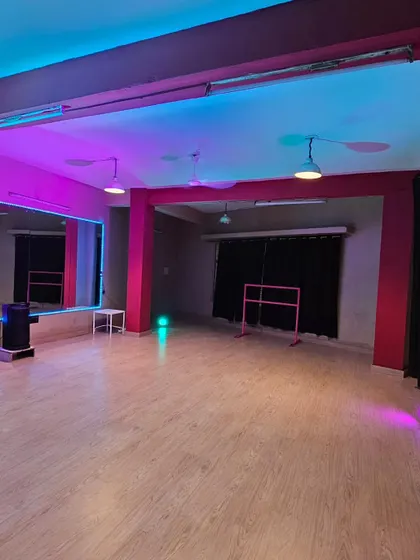 Welcome to my creative playground. I designed this studio with vibrant, fully controllable RGB lighting and mirrored walls to be the perfect backdrop for your dance reels, photoshoots, or private practice sessions.