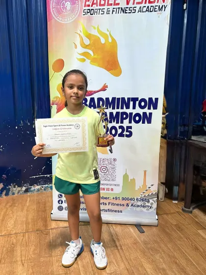 Srishti, another winner from the Eagle Vision Tournament, proudly displays her award. We celebrate each player's individual journey and success.