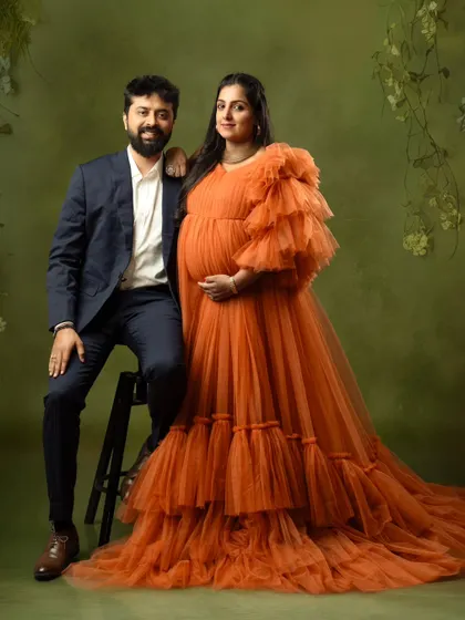A classic seated portrait of a couple, exuding elegance and happiness in our studio.