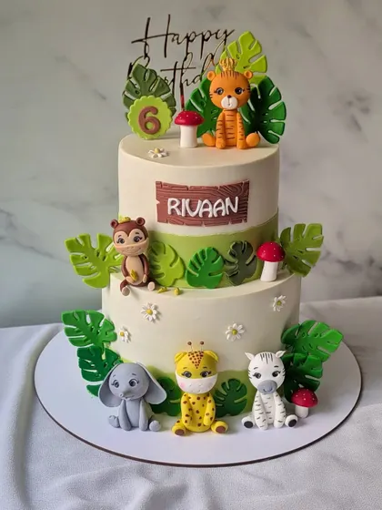 Bringing the jungle to Rivaan's 6th birthday with this two-tier cake. It's a 5kg chocolate cake decorated with adorable, handcrafted jungle animals.