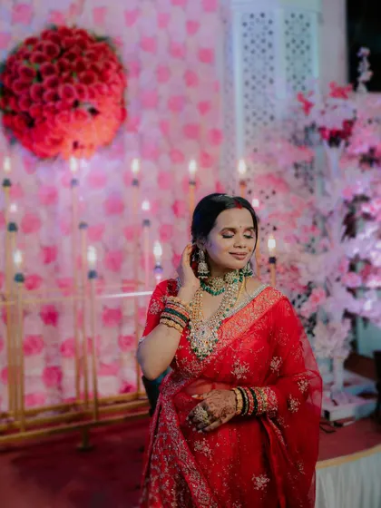 A candid and beautiful shot of the bride during her reception, with a soft, glowing background.