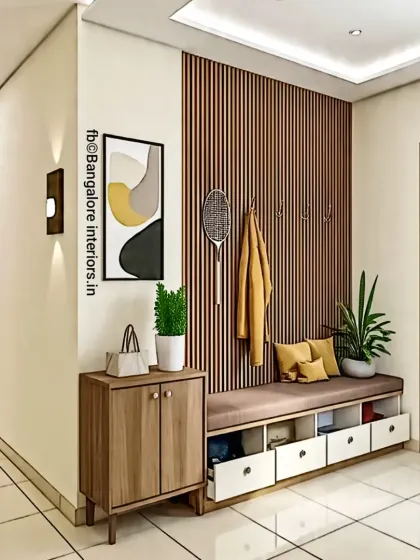 This entryway unit combines a seating bench with open shoe storage, coat hooks, and a closed cabinet, making it highly functional.