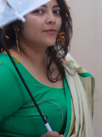 A creative self-portrait using an umbrella to frame the shot. This is from a series where I experimented with props and traditional Indian wear.