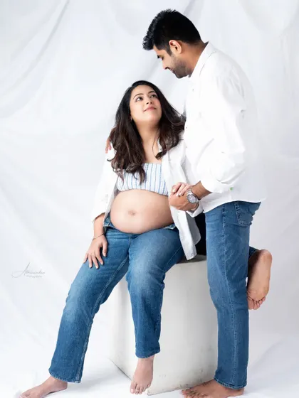 A sweet and loving gaze. This photo captures the deep connection between the couple as they look forward to meeting their baby.