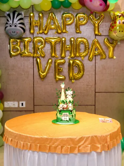 A jungle-themed birthday setup with 'Happy Birthday' balloons. We capture all the elements that create a festive party atmosphere.
