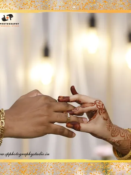 A beautifully framed shot of the ring exchange. This symbolic gesture is a key moment in any engagement, and we capture it with artistic flair.