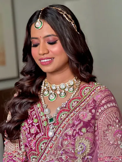 A close-up of the eye makeup for this look. The shimmery pink shadow and defined lash line make the eyes pop, while the skin remains fresh and dewy.