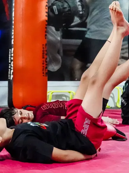 Young fighters doing core exercises. We focus on building a strong foundation to prepare our little champs for the future.