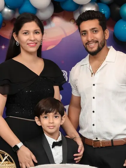 A stylish family portrait at a space-themed 5th birthday party. We work with families to get both formal and candid shots that reflect their personality and the fun of the day.