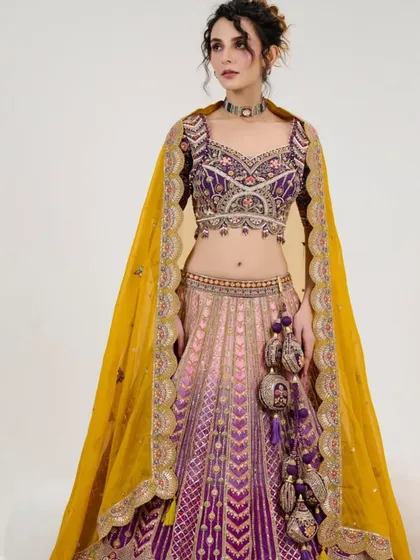 A different angle of the multi-color lehenga, focusing on the intricate blouse and the beautiful latkans.