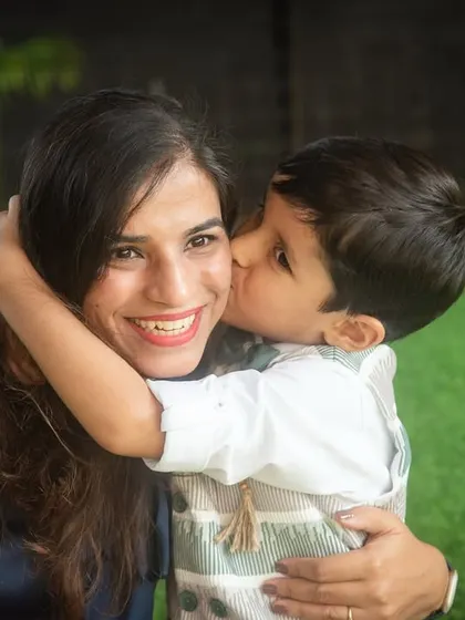 A sweet birthday kiss for mom. These are the precious, fleeting moments that you'll want to remember long after the party is over.