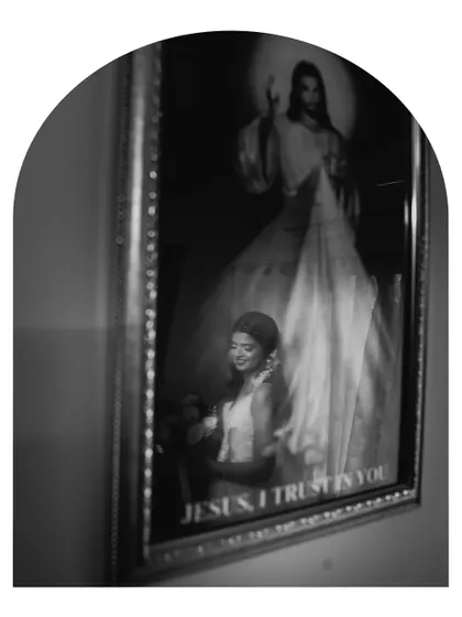 An artistic black and white reflection shot of the bride. This creative composition adds a layer of depth and symbolism to the bridal portrait.