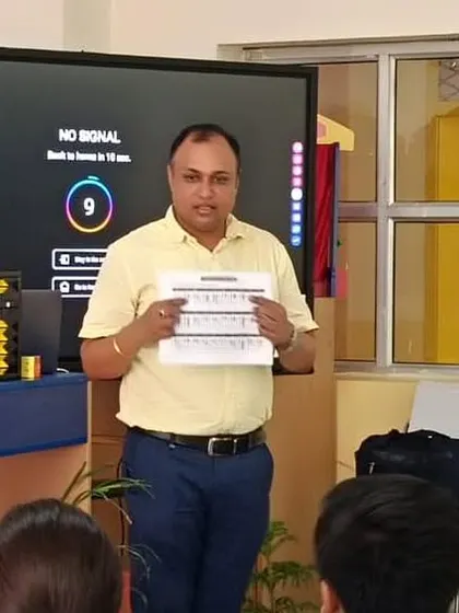 Showcasing the structured worksheets that are part of our curriculum during a school presentation.