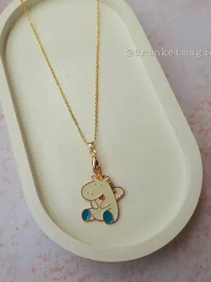 This quirky and cute unicorn necklace is sure to bring a smile. The sitting unicorn charm has a playful and unique design.