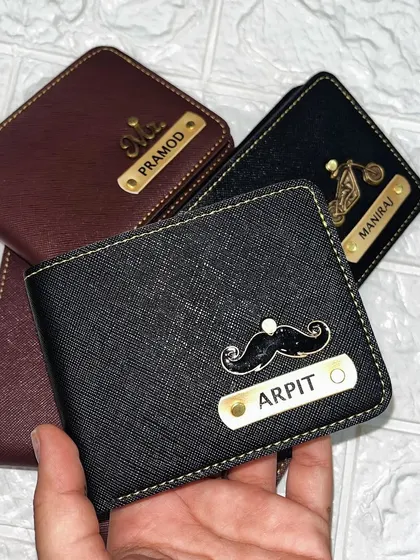 I love creating these unique combinations. This black wallet for "Arpit" features a fun mustache charm, adding a touch of personality to a practical, everyday item.