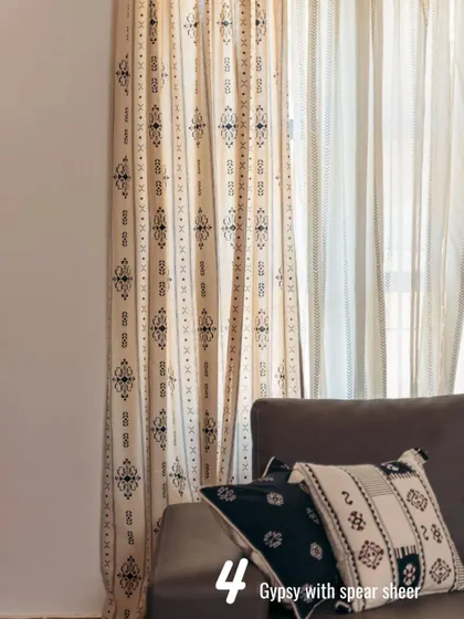 Our tribal-inspired Gypsy print curtain is layered with a Spear Sheer. The monochrome palette and geometric patterns create a bold yet refined look that works well in modern homes.