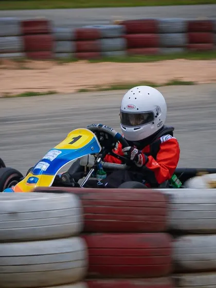 A Micro driver navigates a corner with focus and determination.