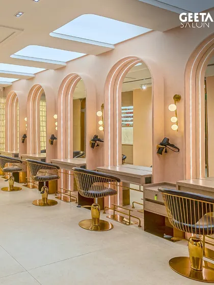 The main styling floor at Shilp Shivalik, with its high ceilings, skylights, and soft pink arches creating a bright and airy space.